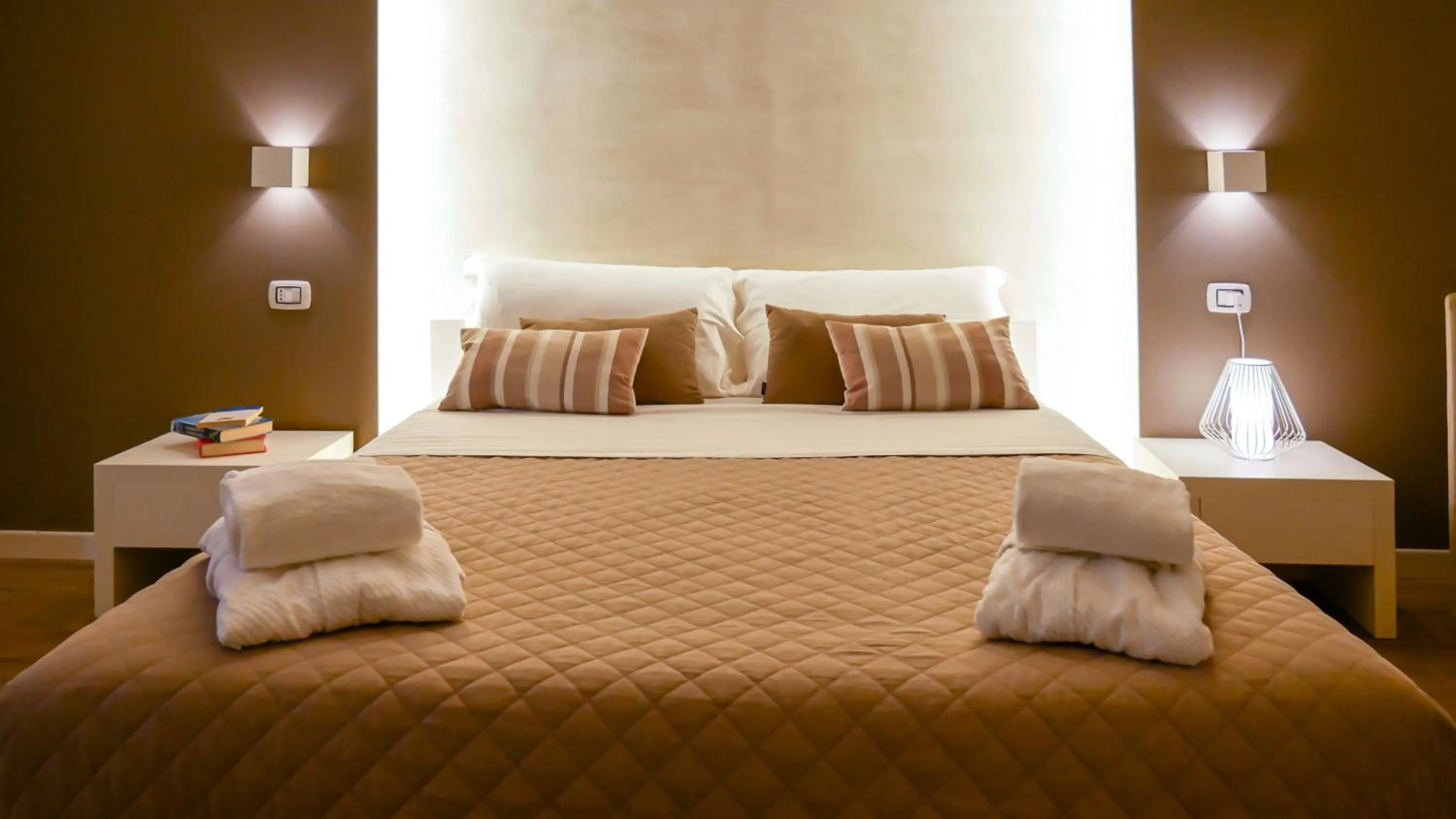 Bed in La Banchina Holiday Rooms
