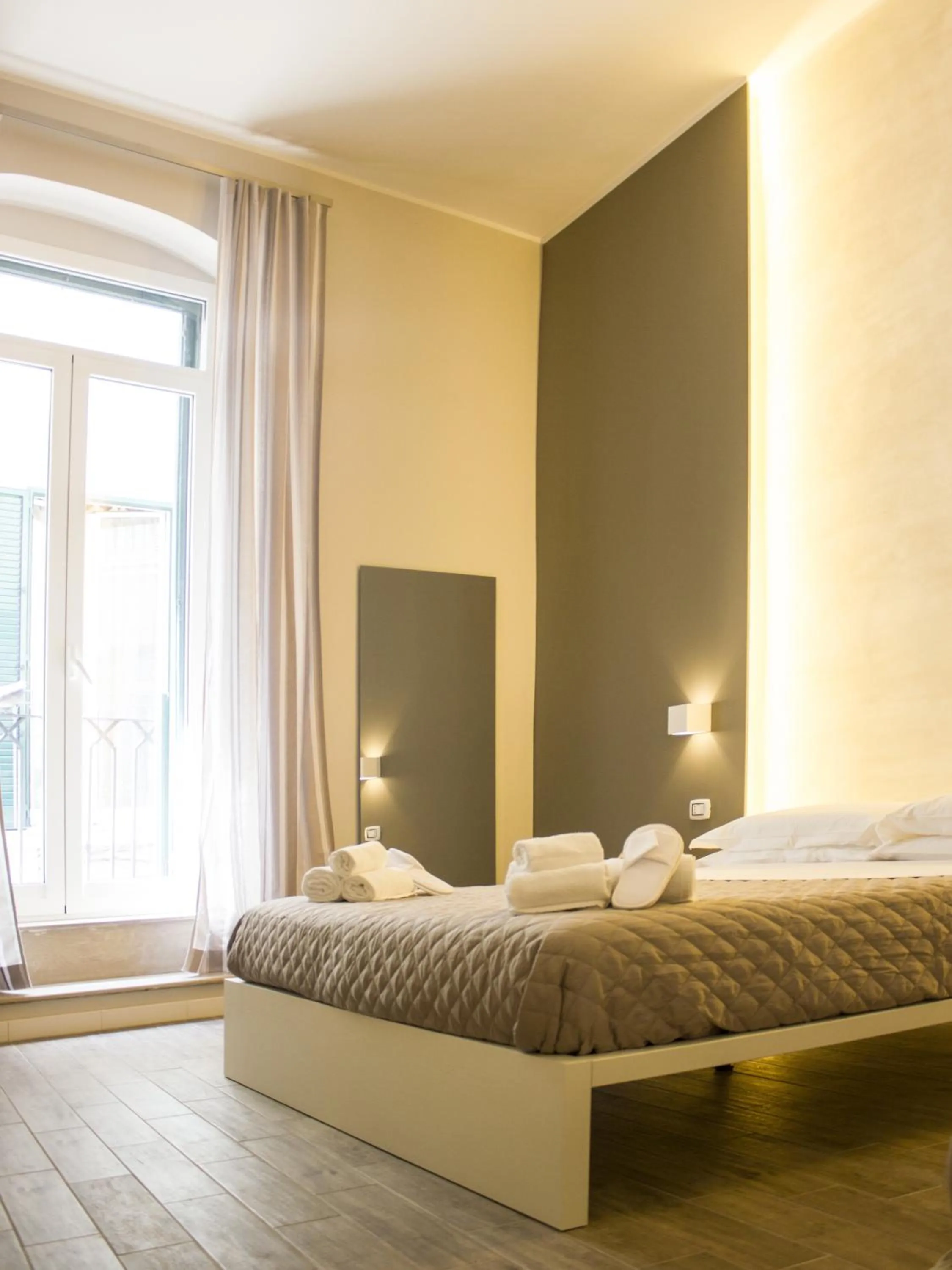 Bed in La Banchina Holiday Rooms