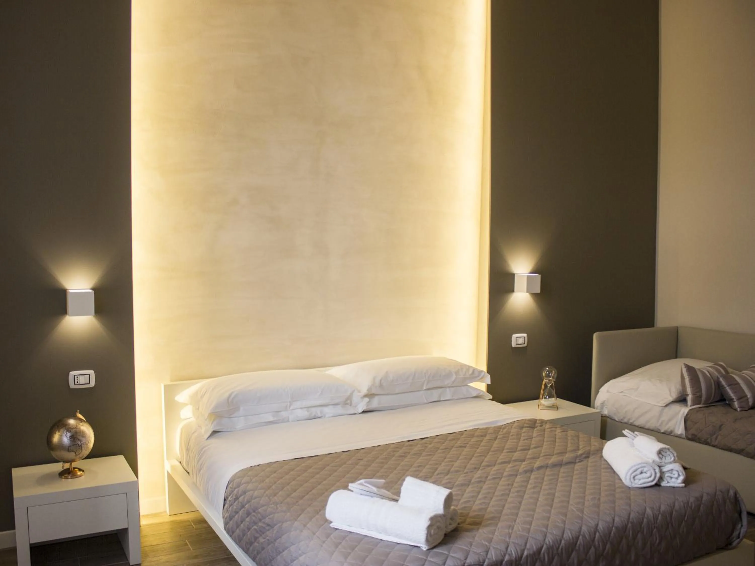 Bed in La Banchina Holiday Rooms
