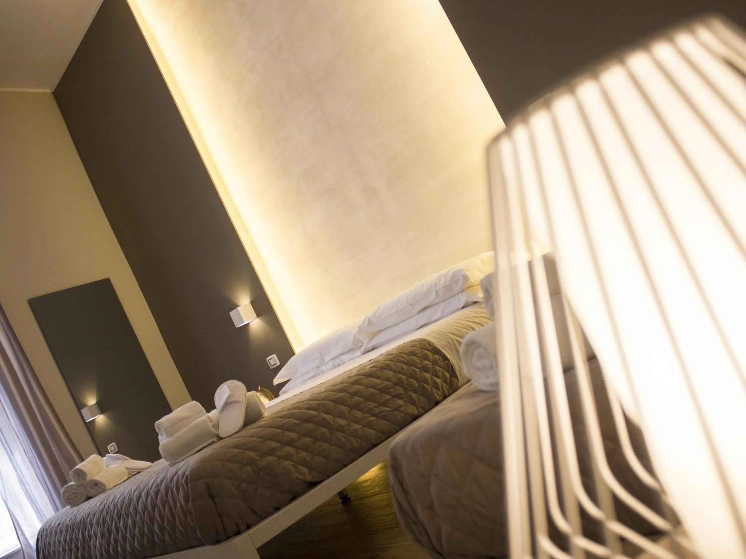 Bed in La Banchina Holiday Rooms