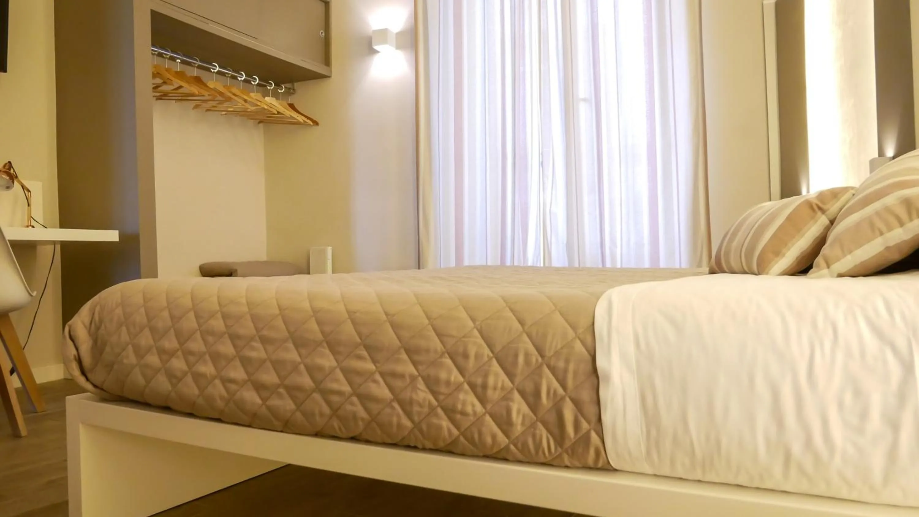 Bed in La Banchina Holiday Rooms