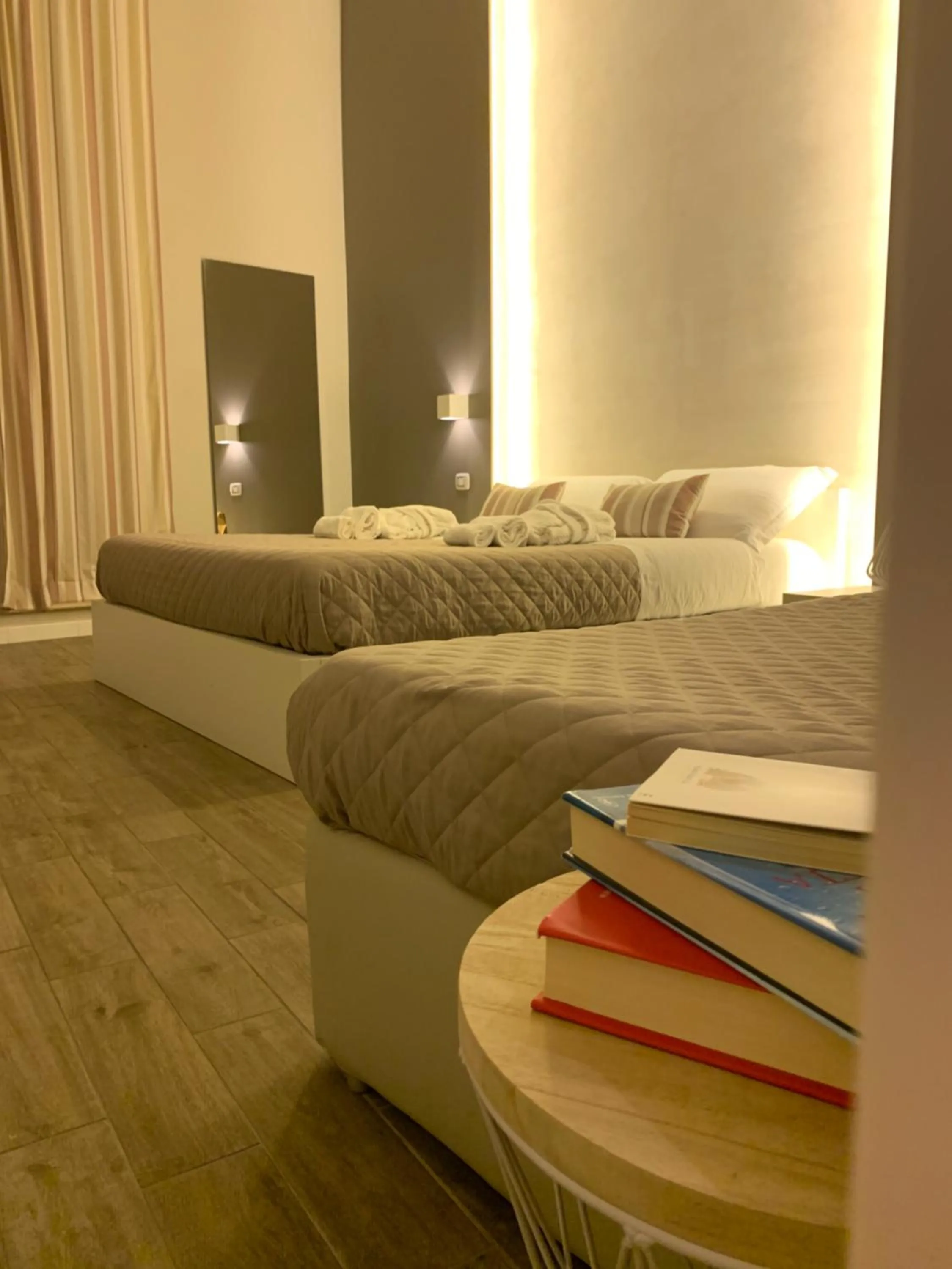 Bed in La Banchina Holiday Rooms