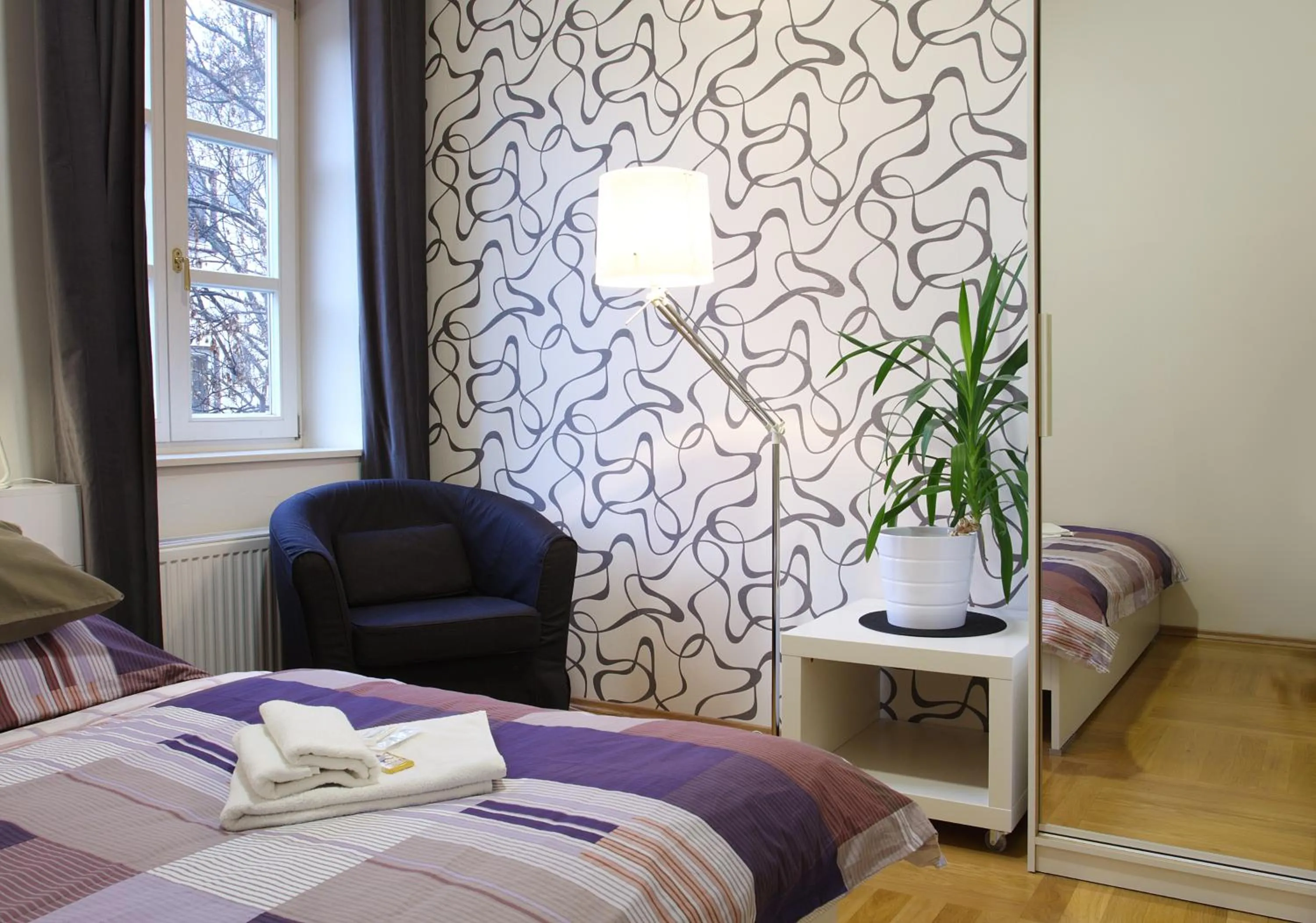 Bed in Atrium Apartments