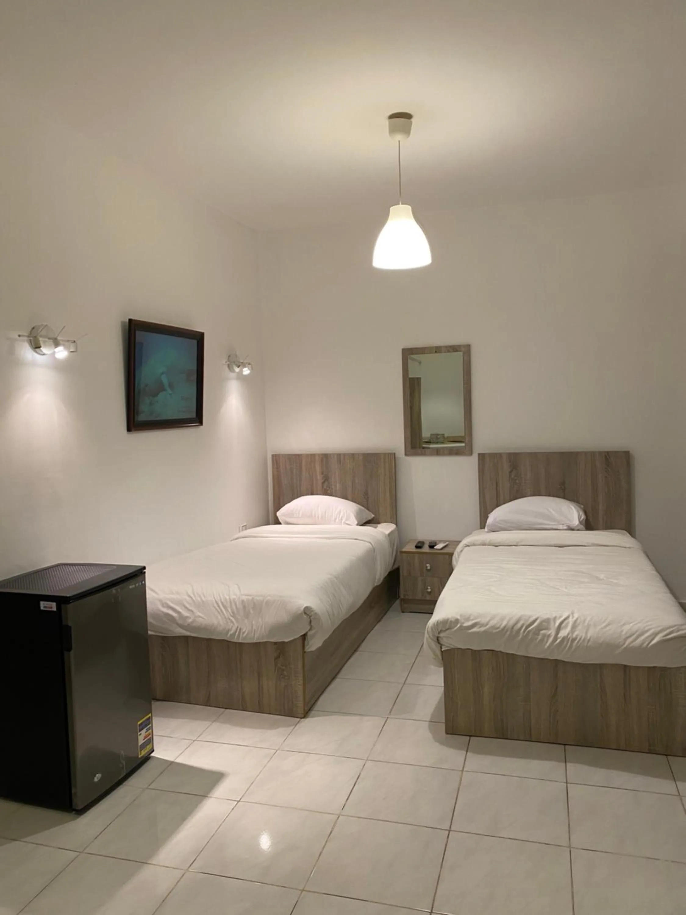 Bed in Blue Vision Diving Hotel