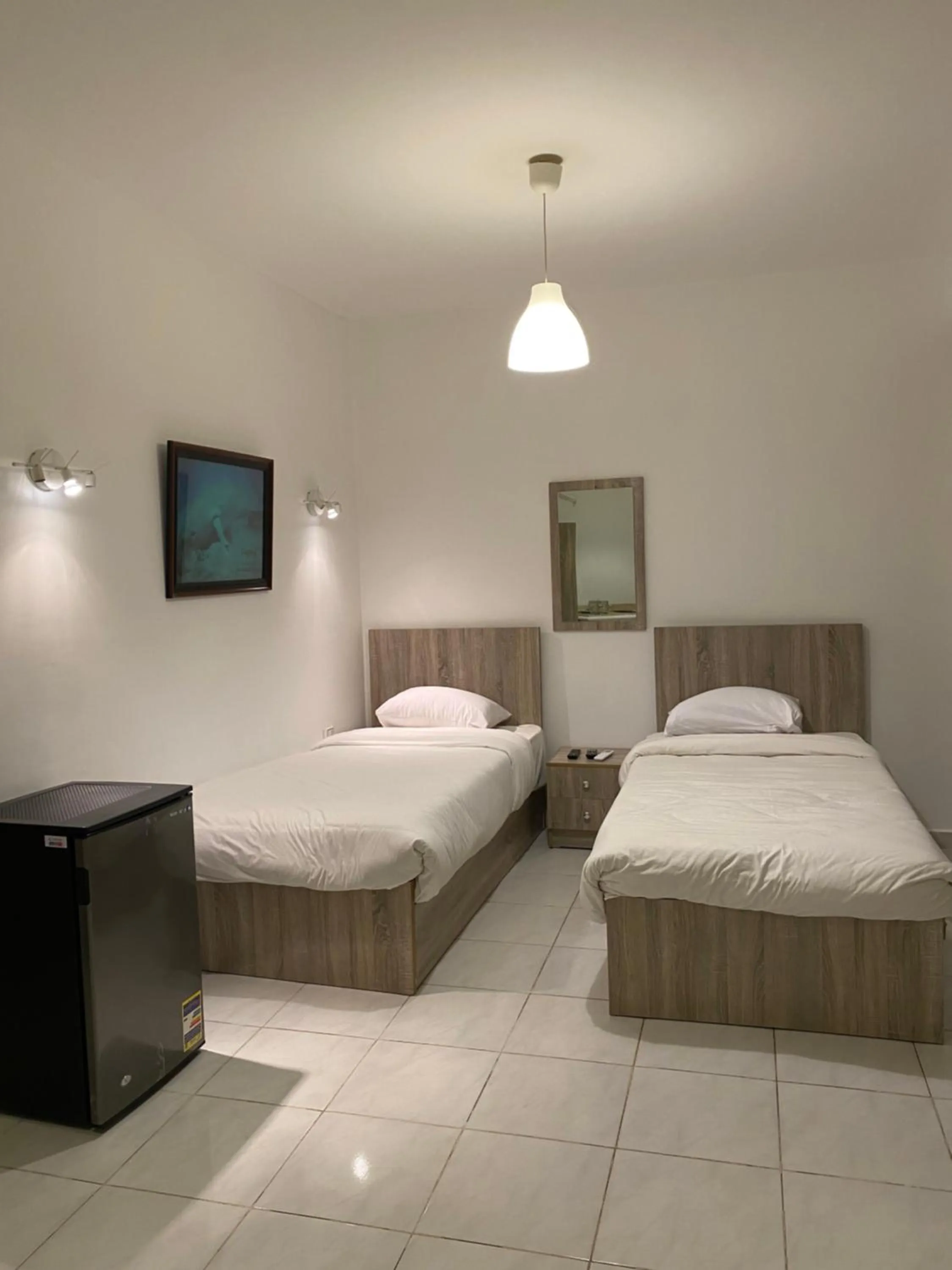 Bed in Blue Vision Diving Hotel