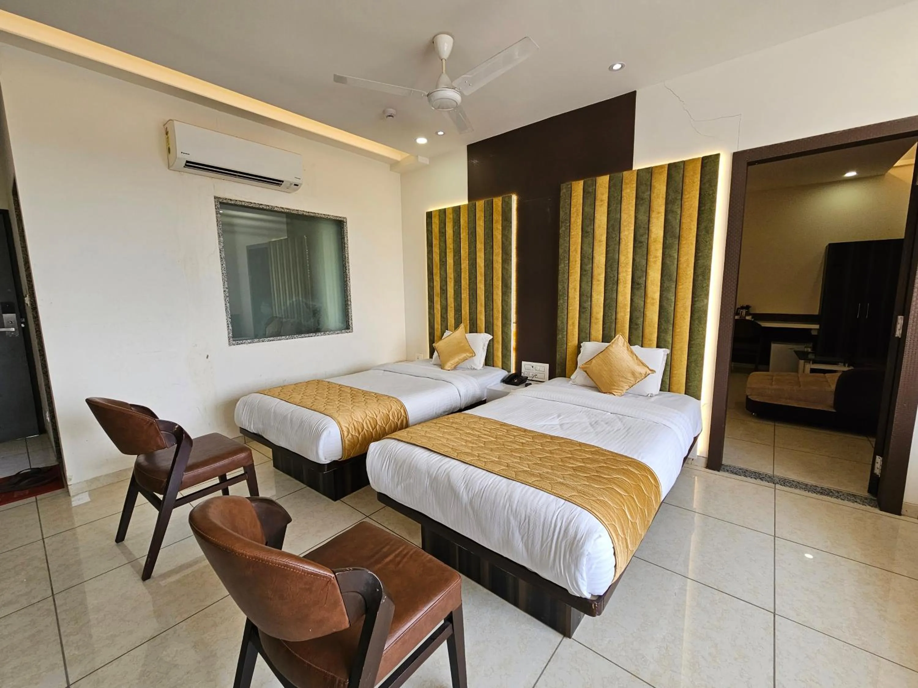 Bed in Hotel Grand Darshan Vadodara