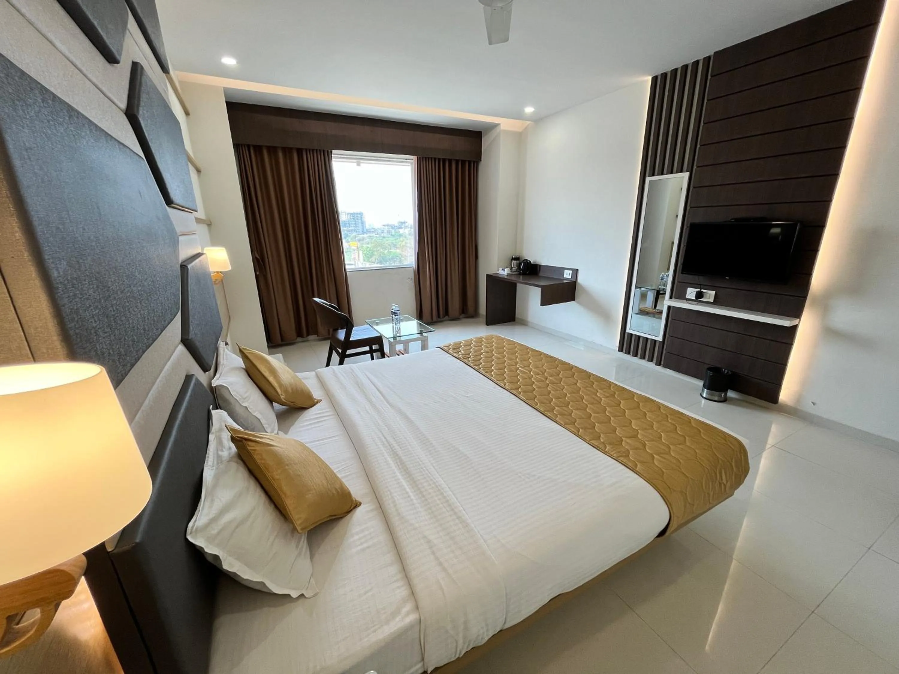 Bed in Hotel Grand Darshan Vadodara