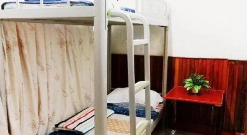 Bed in New Lao Paris Hotel