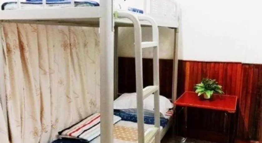 Bed in New Lao Paris Hotel