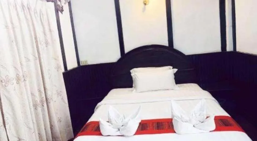 Bed in New Lao Paris Hotel