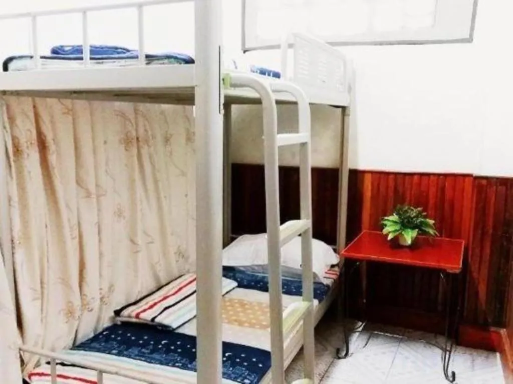 Bed in New Lao Paris Hotel