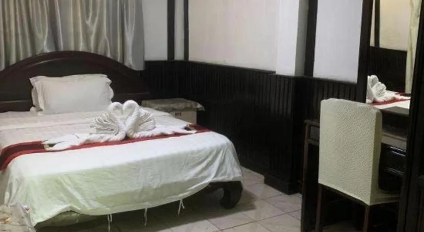 Bed in New Lao Paris Hotel