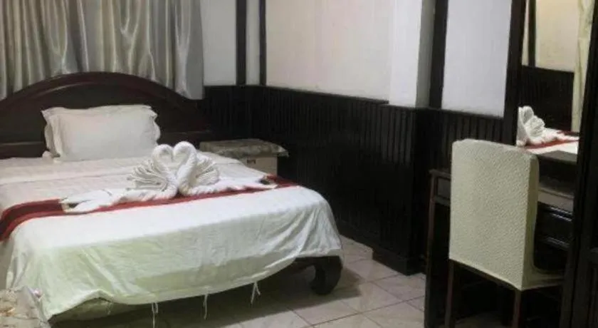 Bed in New Lao Paris Hotel