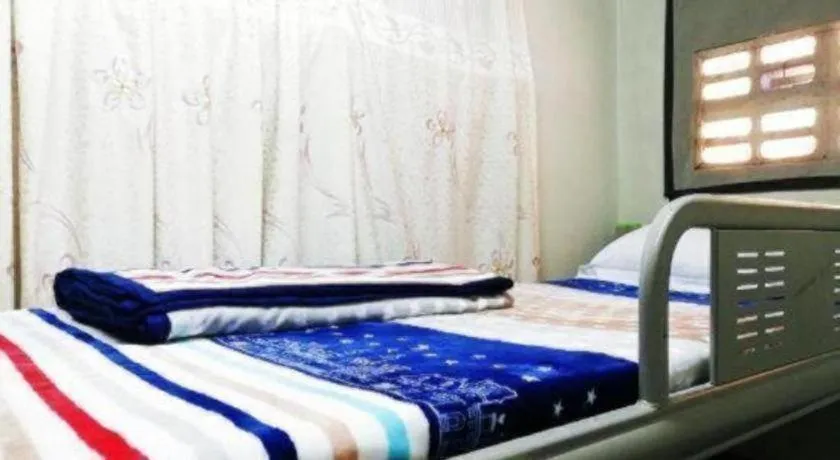 Bed in New Lao Paris Hotel