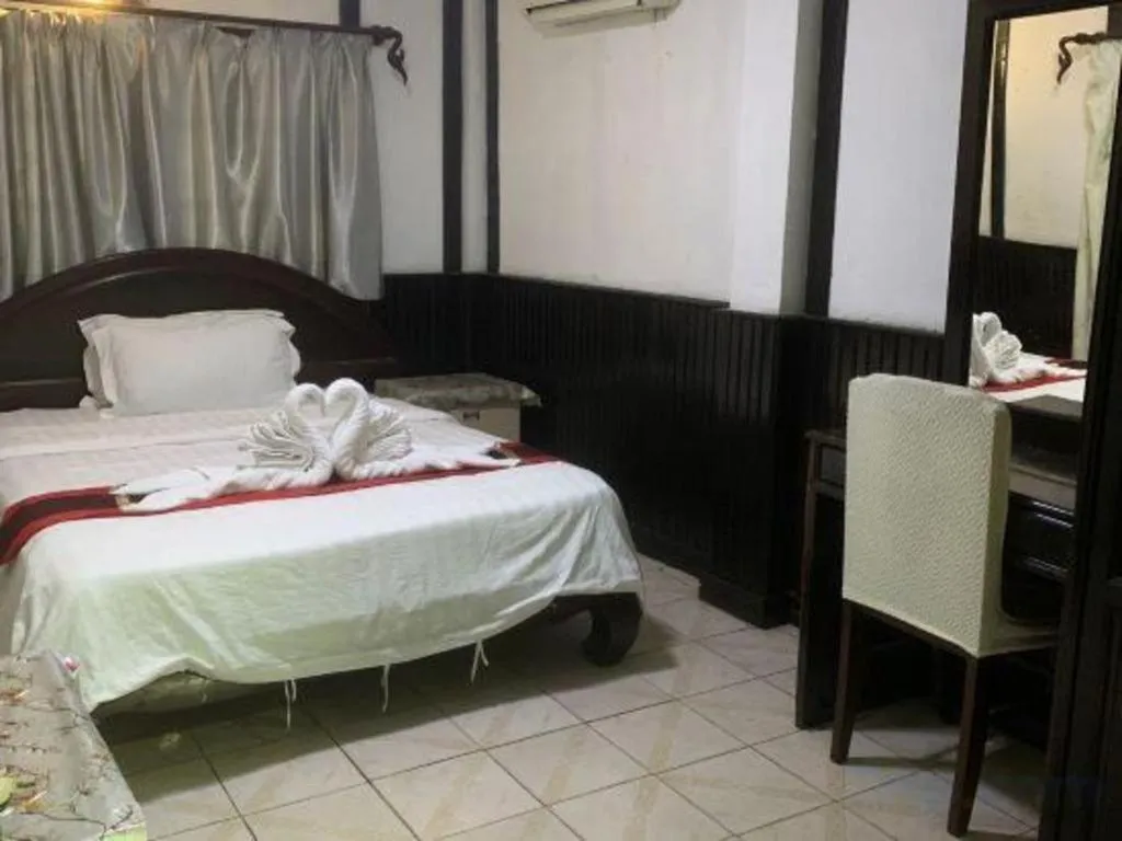 Bed in New Lao Paris Hotel