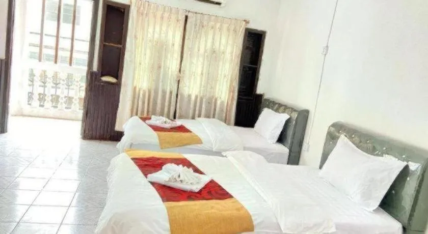 Bed in New Lao Paris Hotel