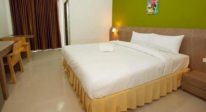 Bed in Soontree House Hotel