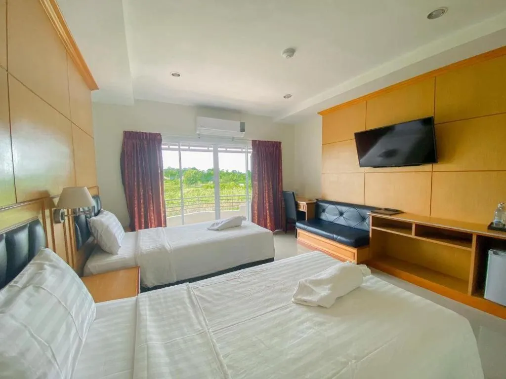 Bed in Siamtara Palace Hotel