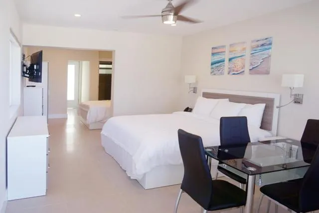 Dining area, Bed in Diane Oceanfront Suites