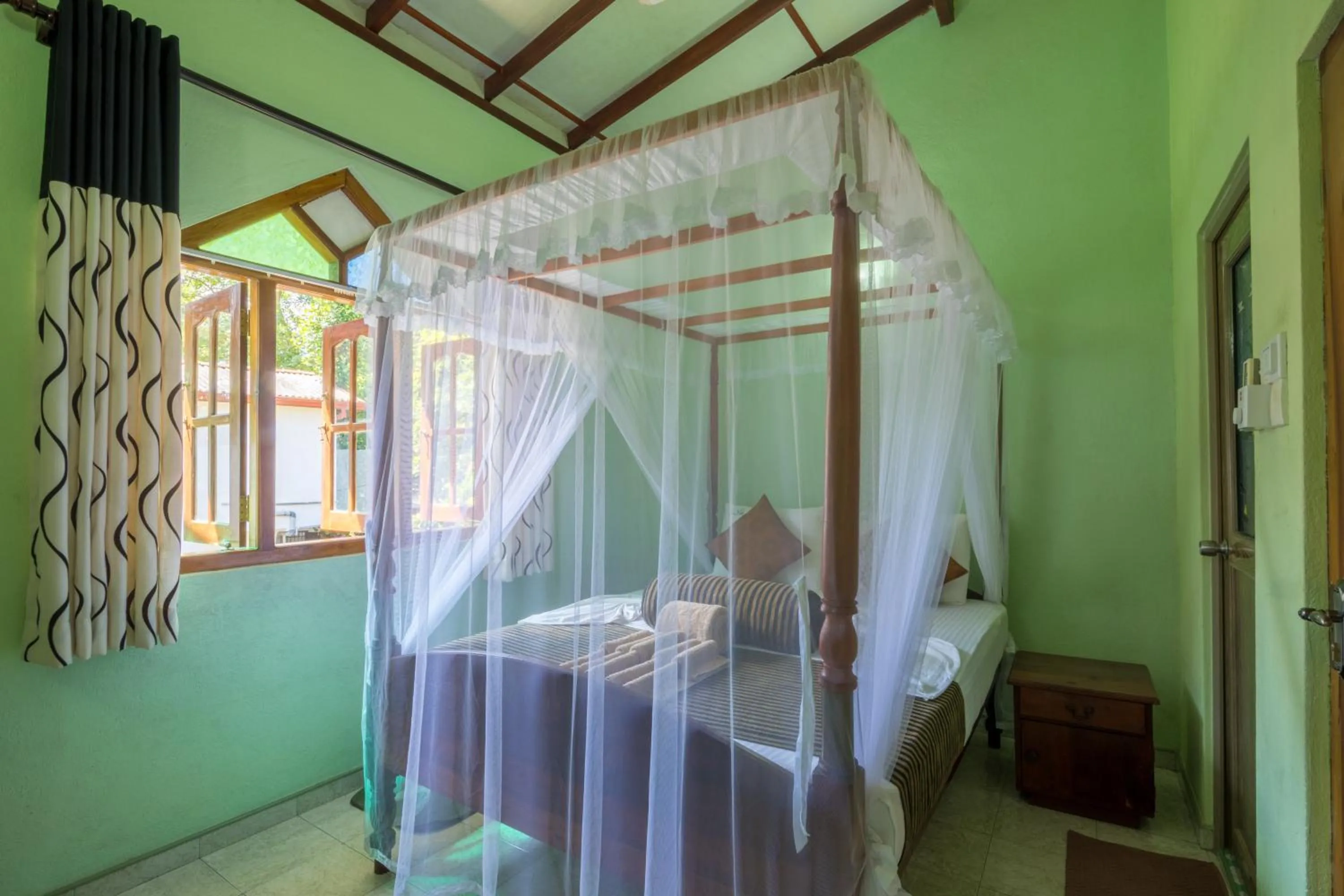 Bed in Green Villa Unawatuna