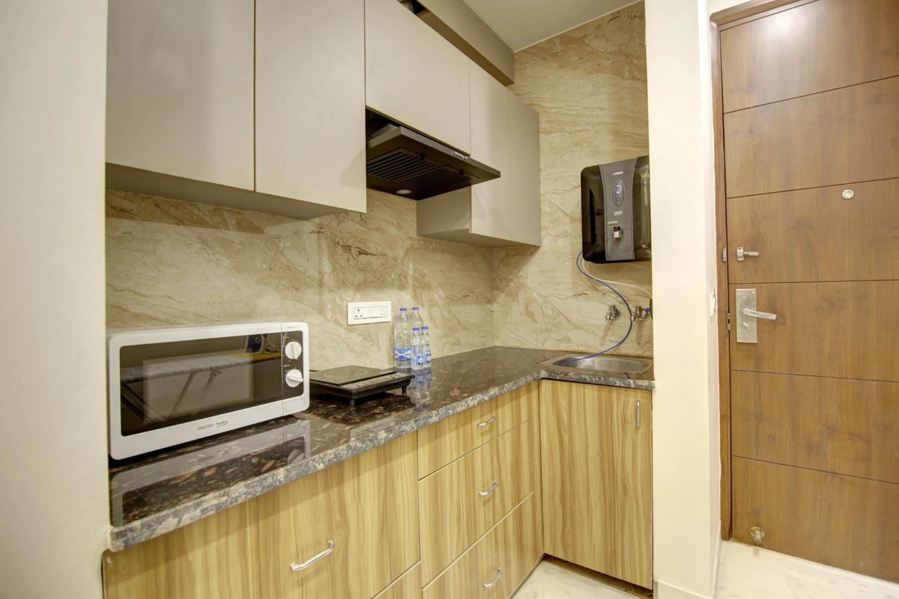 Kitchen or kitchenette in FlxHo Quad - Luxury Studio Apart Hotel DLF Cyber City