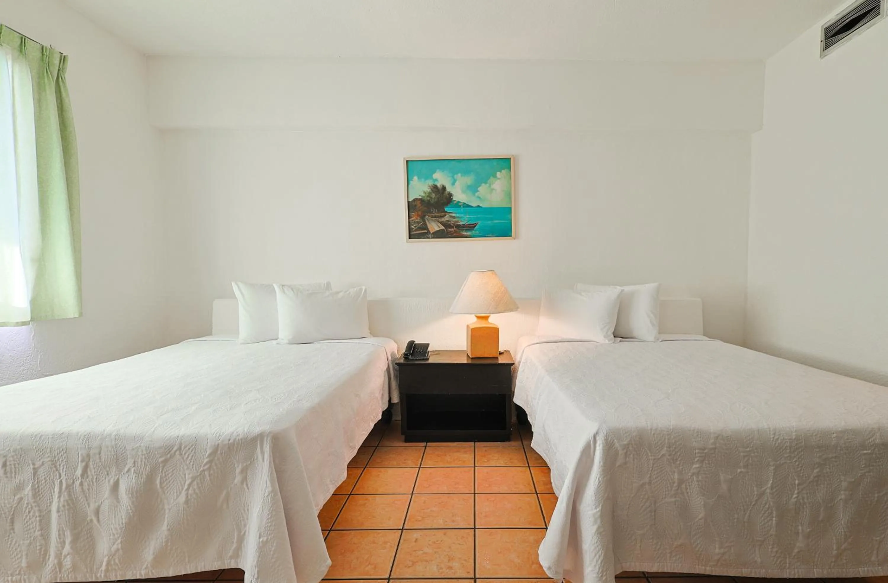 Bed in Hotel Delfín Vista Pier Beach Front