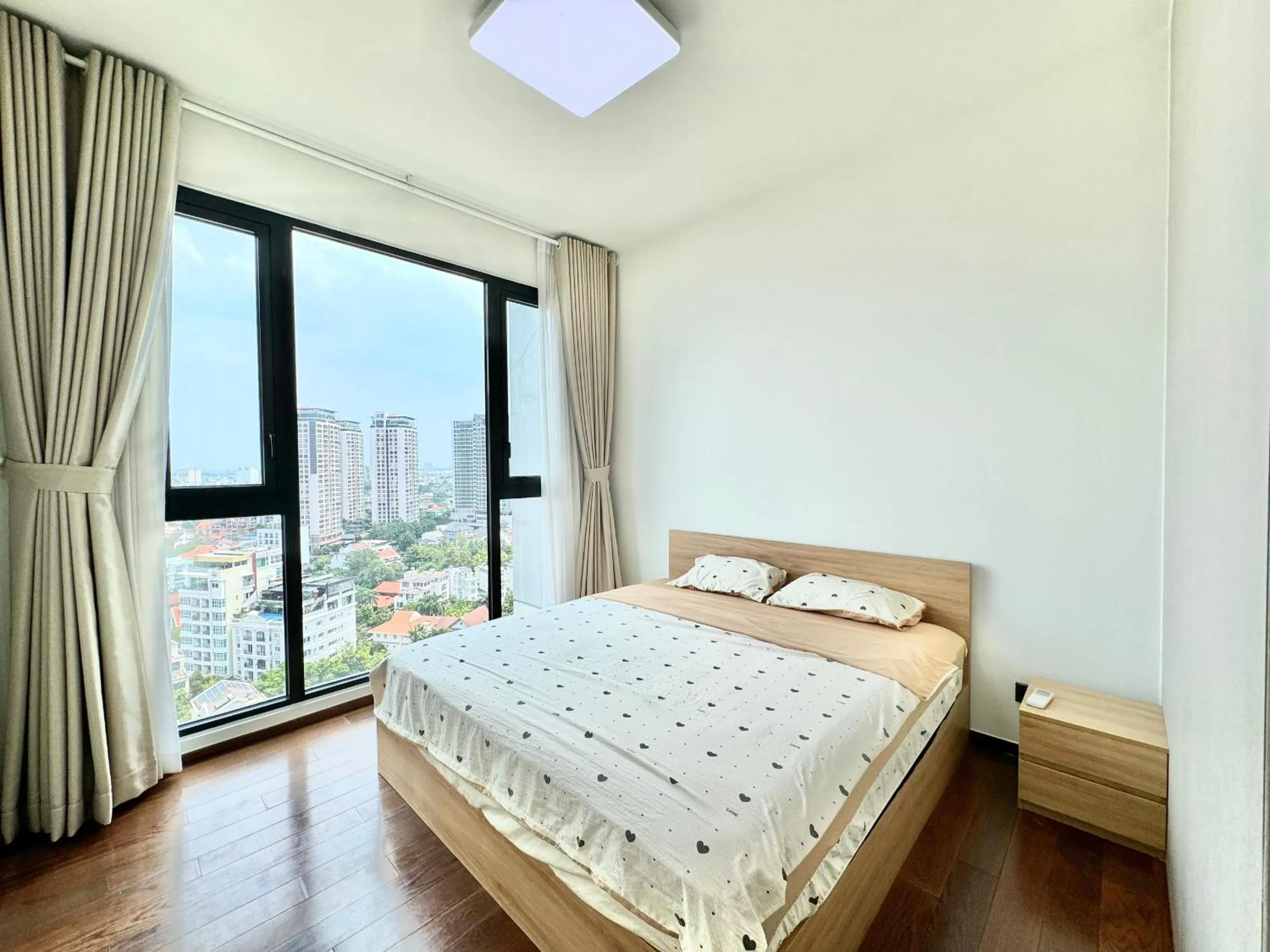 Bed in Homie's Dedge Thao Dien Luxury Apartment