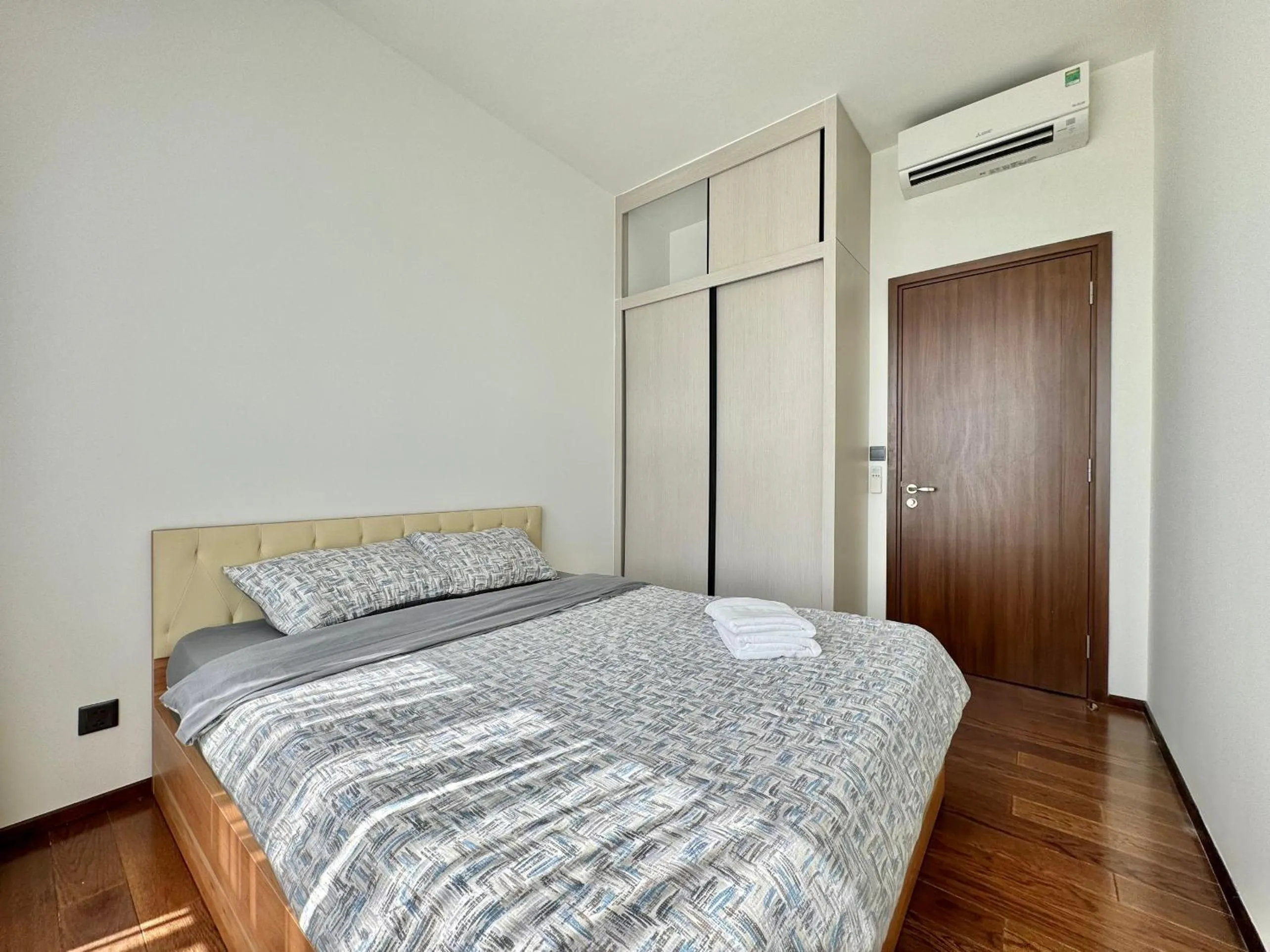 Bed in Homie's Dedge Thao Dien Luxury Apartment