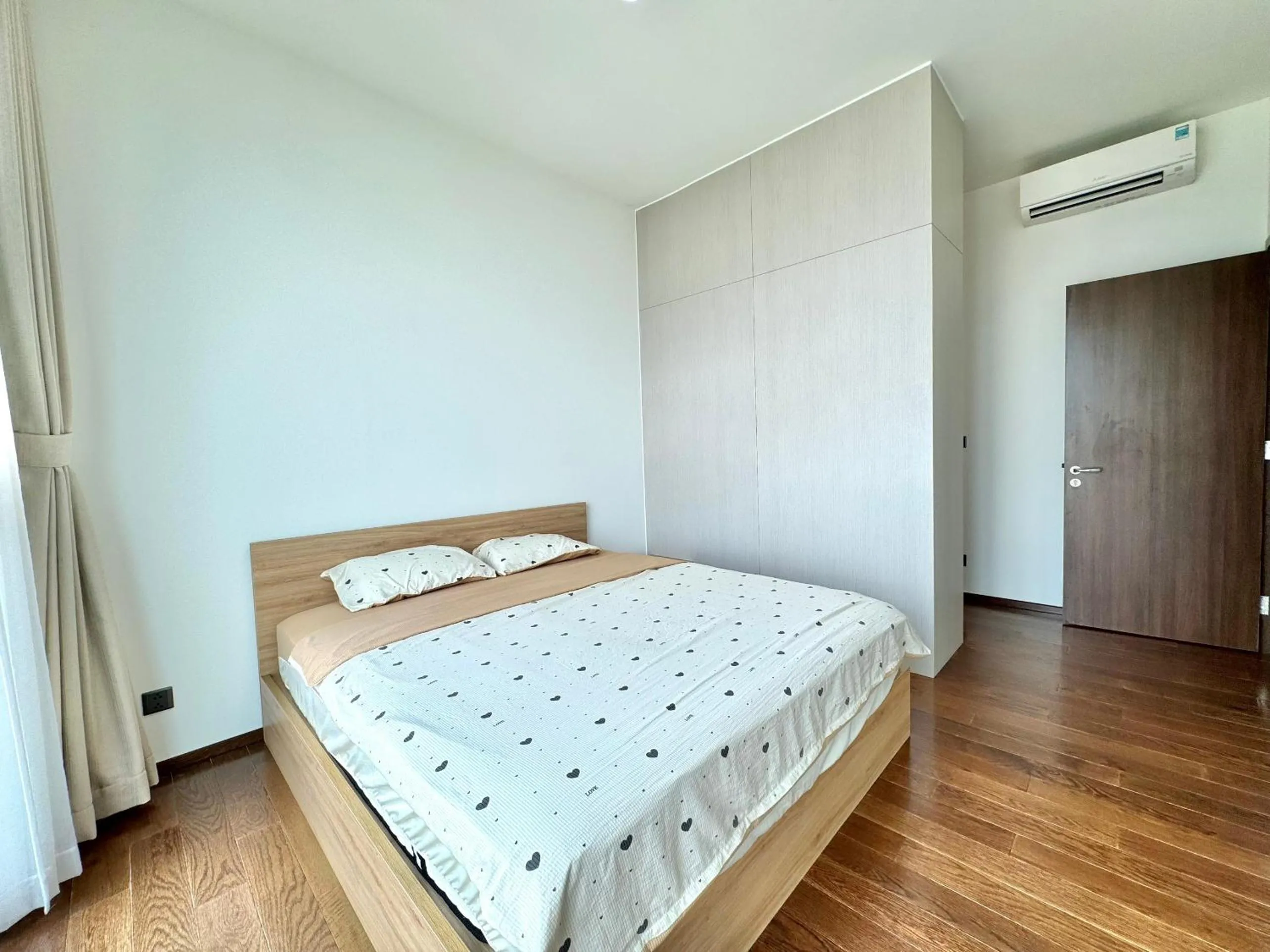 Bed in Homie's Dedge Thao Dien Luxury Apartment