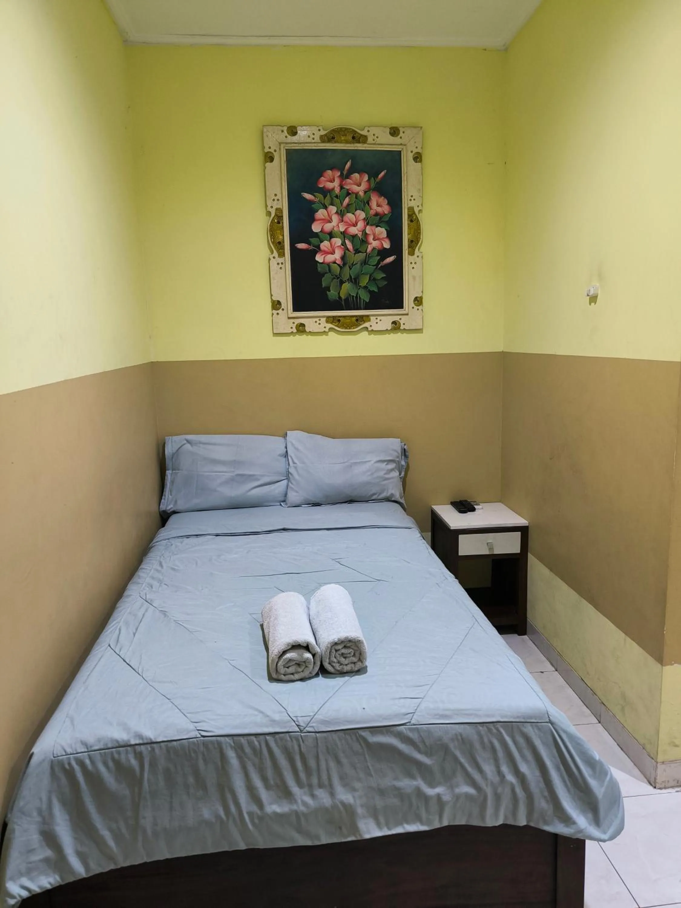 Bed in PROMOSIA GUEST HOUSE