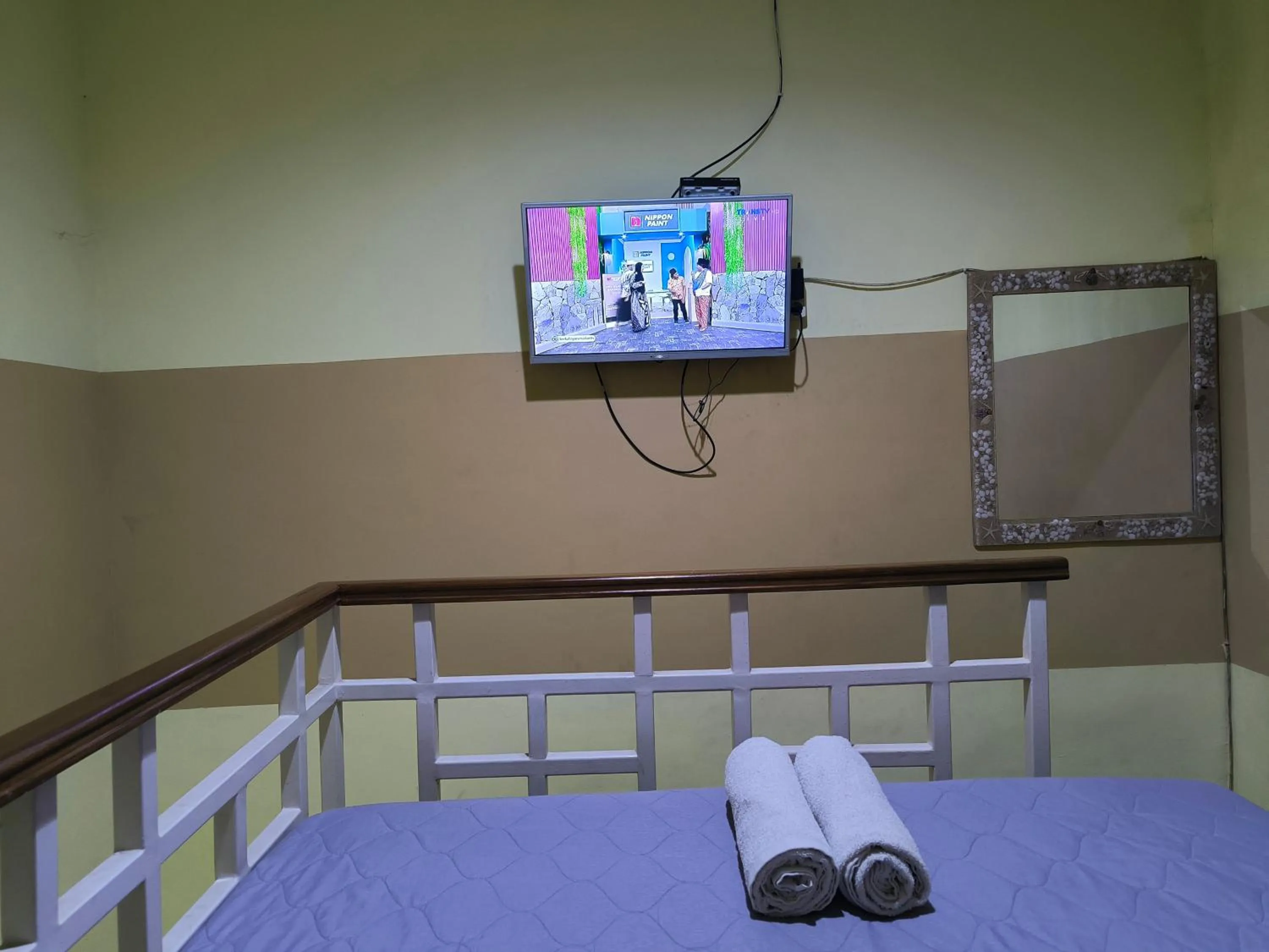 Bed in PROMOSIA GUEST HOUSE