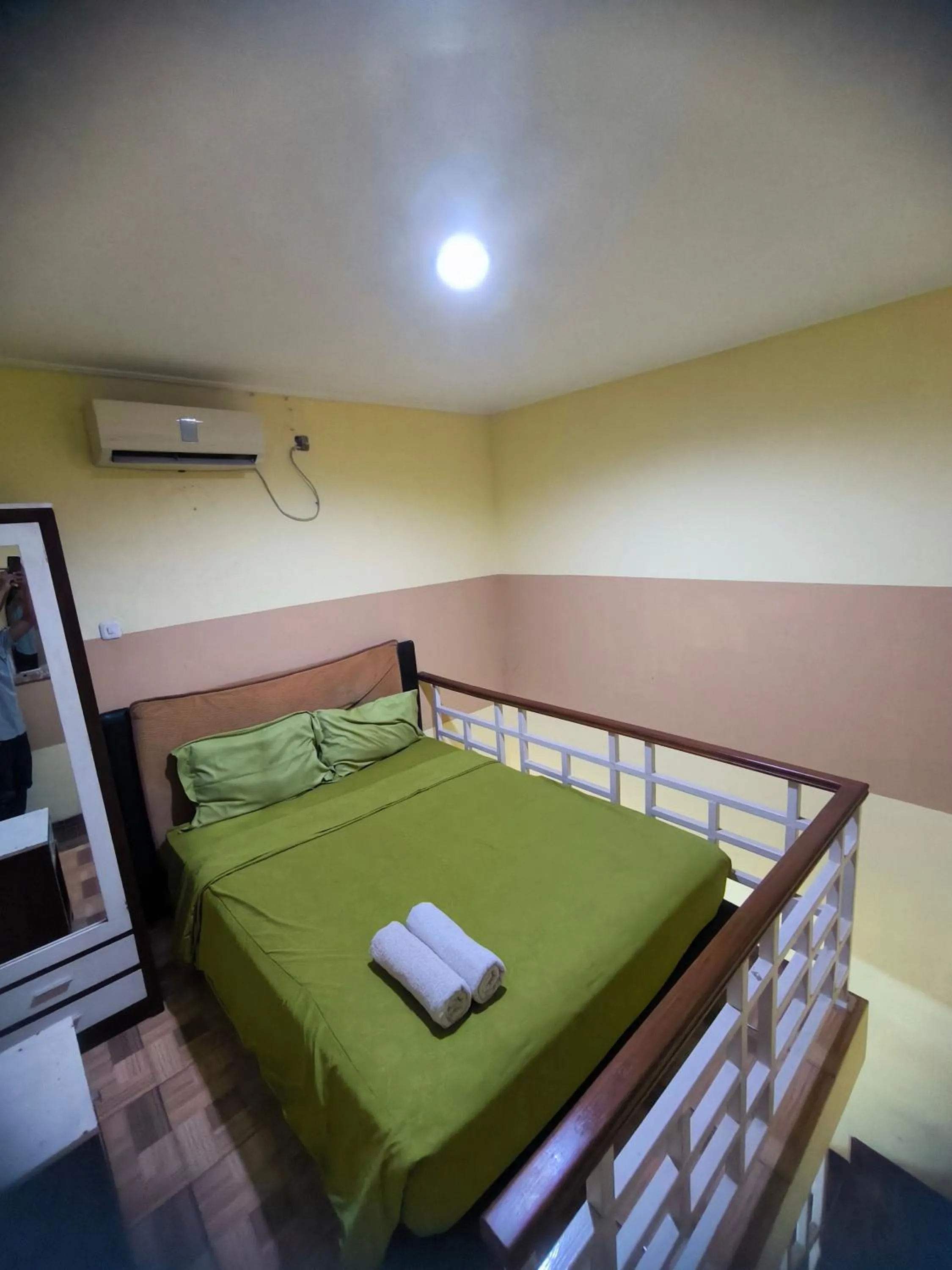 Bed in PROMOSIA GUEST HOUSE