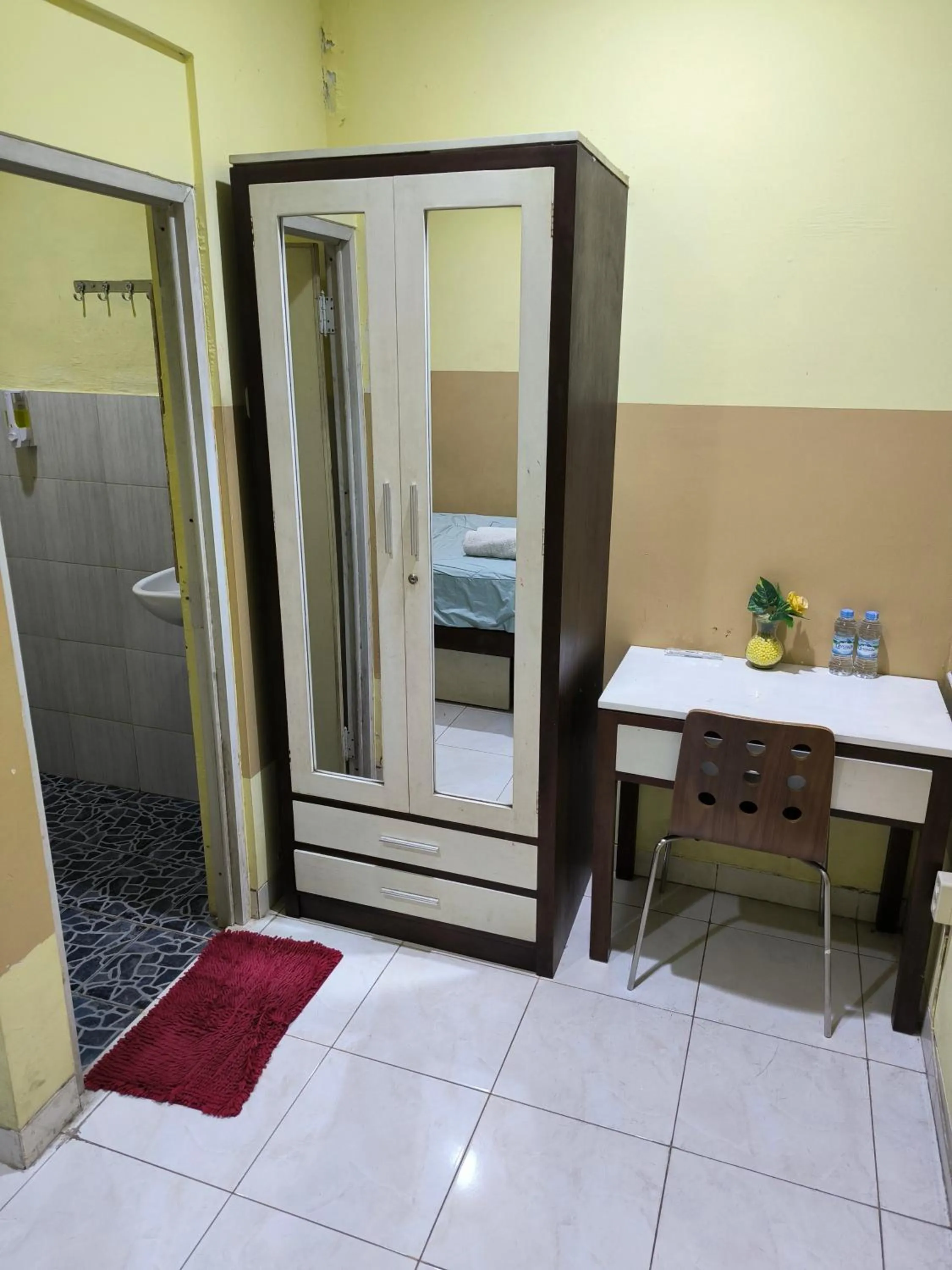 Bed in PROMOSIA GUEST HOUSE