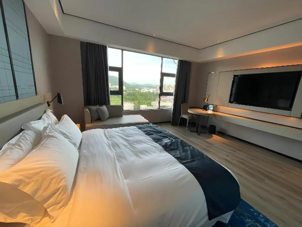 Bed in Echarm Hotel Changjiang Shilu