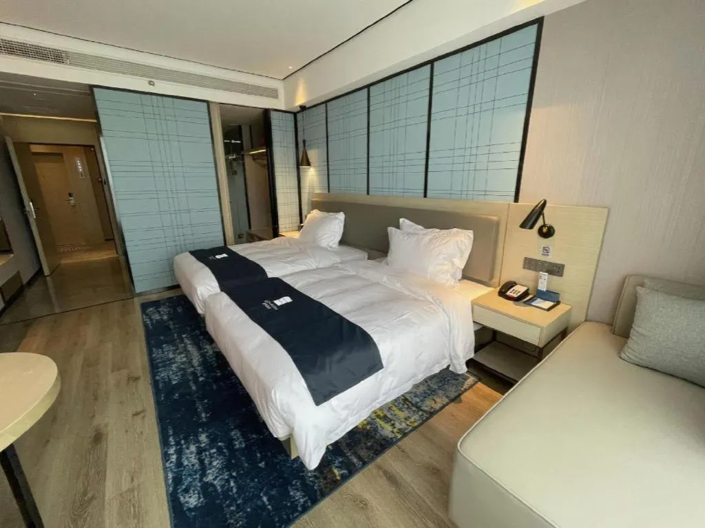 Bed in Echarm Hotel Changjiang Shilu