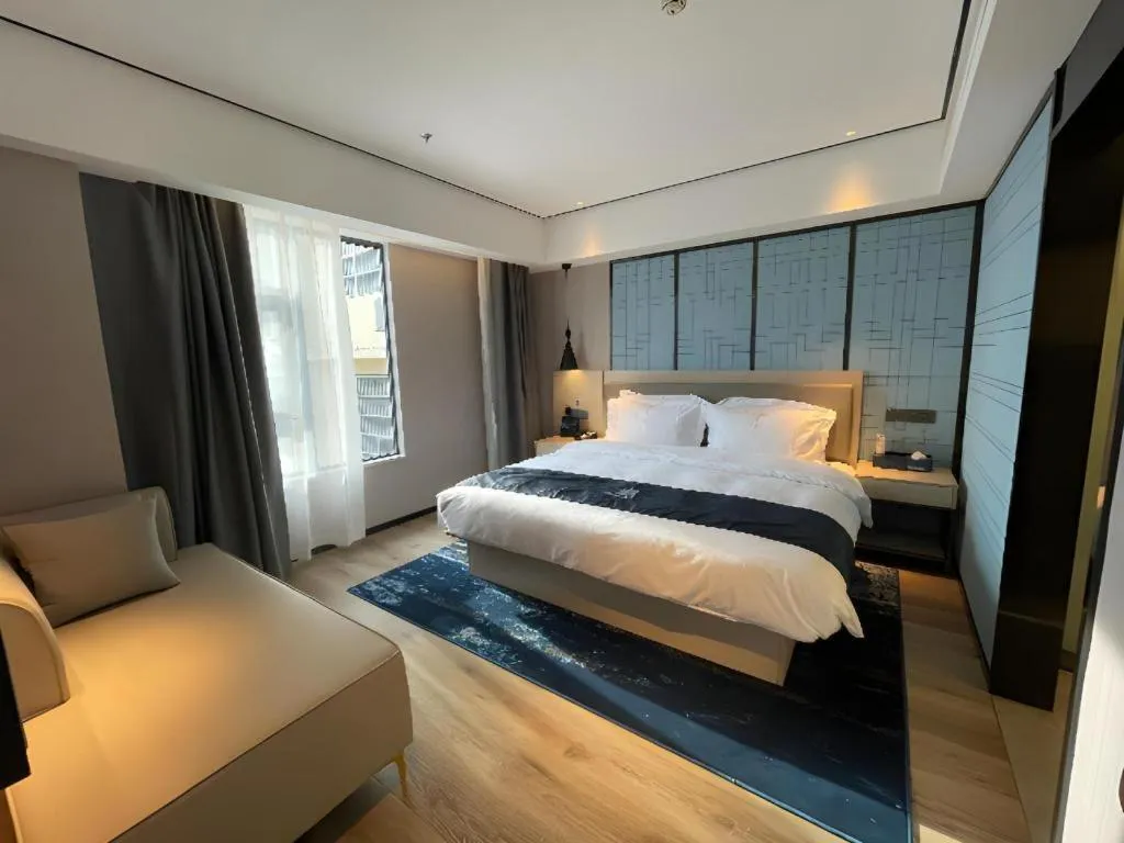 Bed in Echarm Hotel Changjiang Shilu