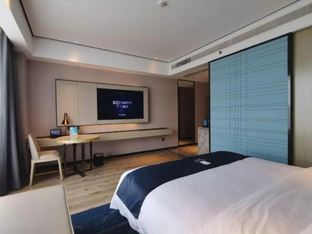 Bed in Echarm Hotel Changjiang Shilu