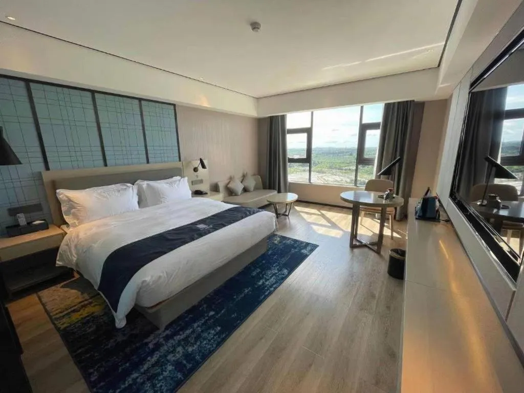 Bed in Echarm Hotel Changjiang Shilu