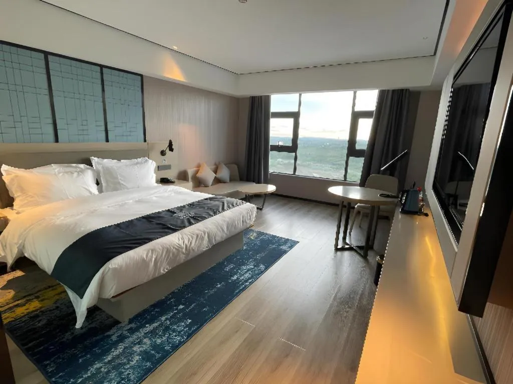 Bed in Echarm Hotel Changjiang Shilu