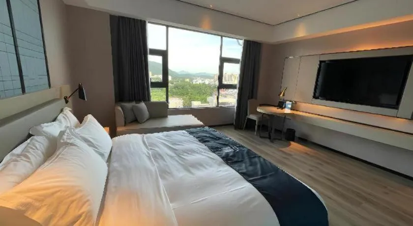 Bed in Echarm Hotel Changjiang Shilu