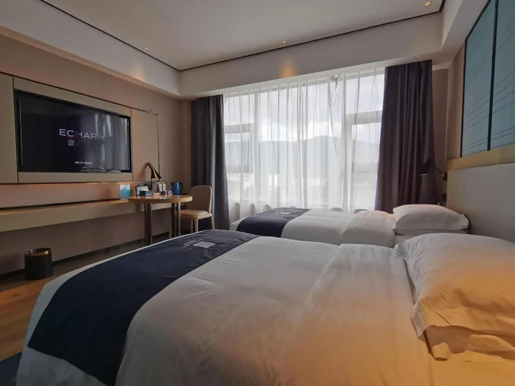 Bed in Echarm Hotel Changjiang Shilu