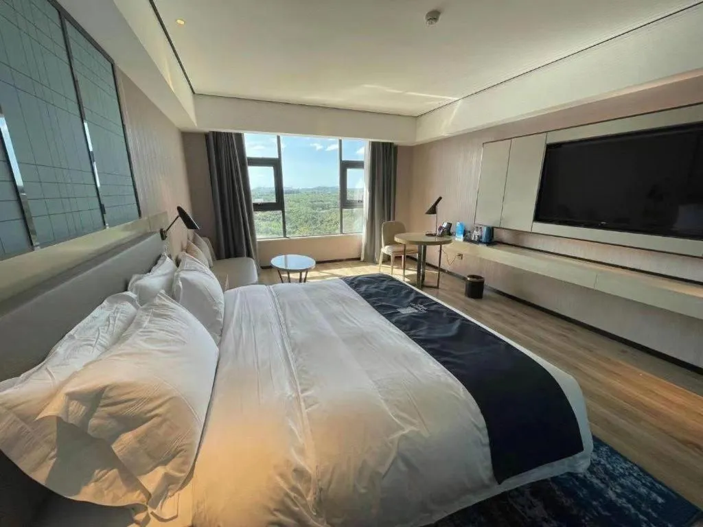 Bed in Echarm Hotel Changjiang Shilu