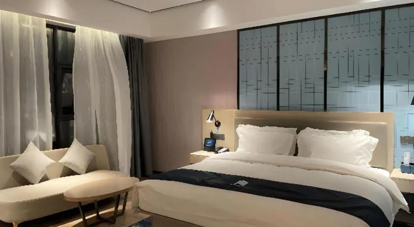Bed in Echarm Hotel Changjiang Shilu