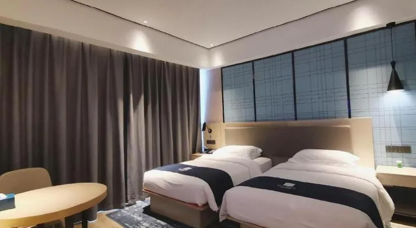 Bed in Echarm Hotel Changjiang Shilu