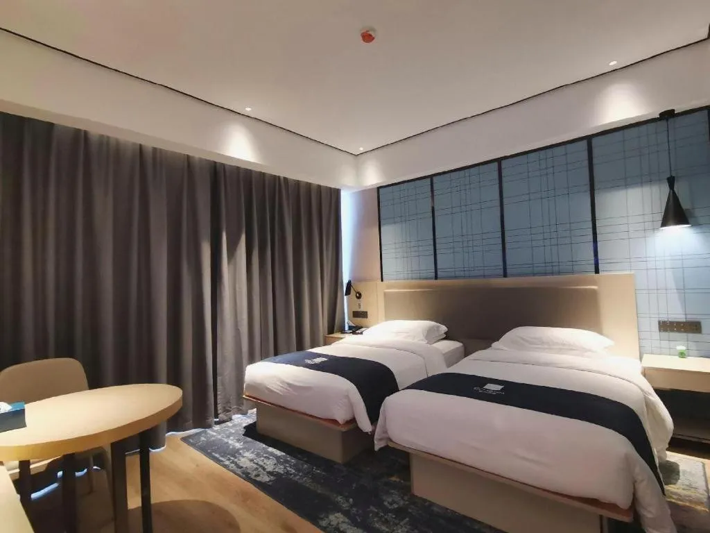 Bed in Echarm Hotel Changjiang Shilu
