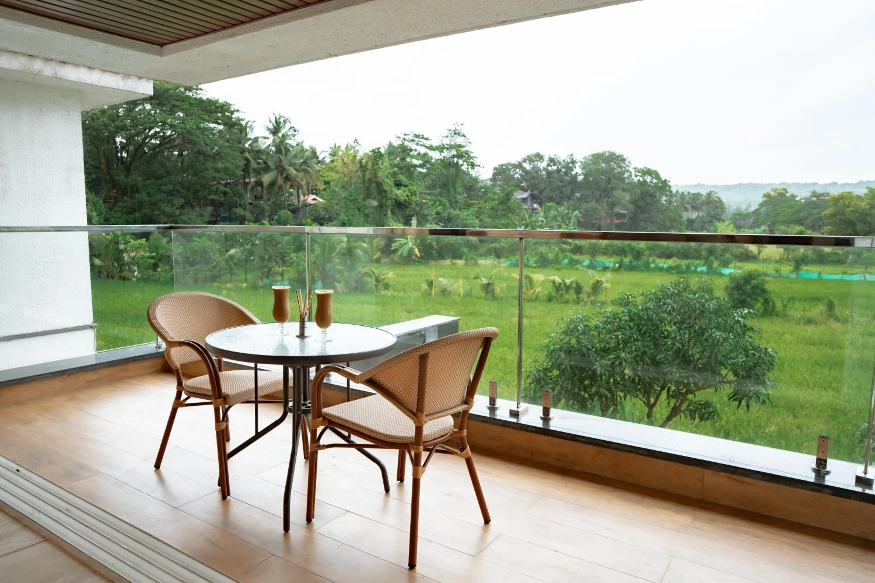 Balcony/Terrace in The Tanisi Resorts & Pool Villas, Candolim