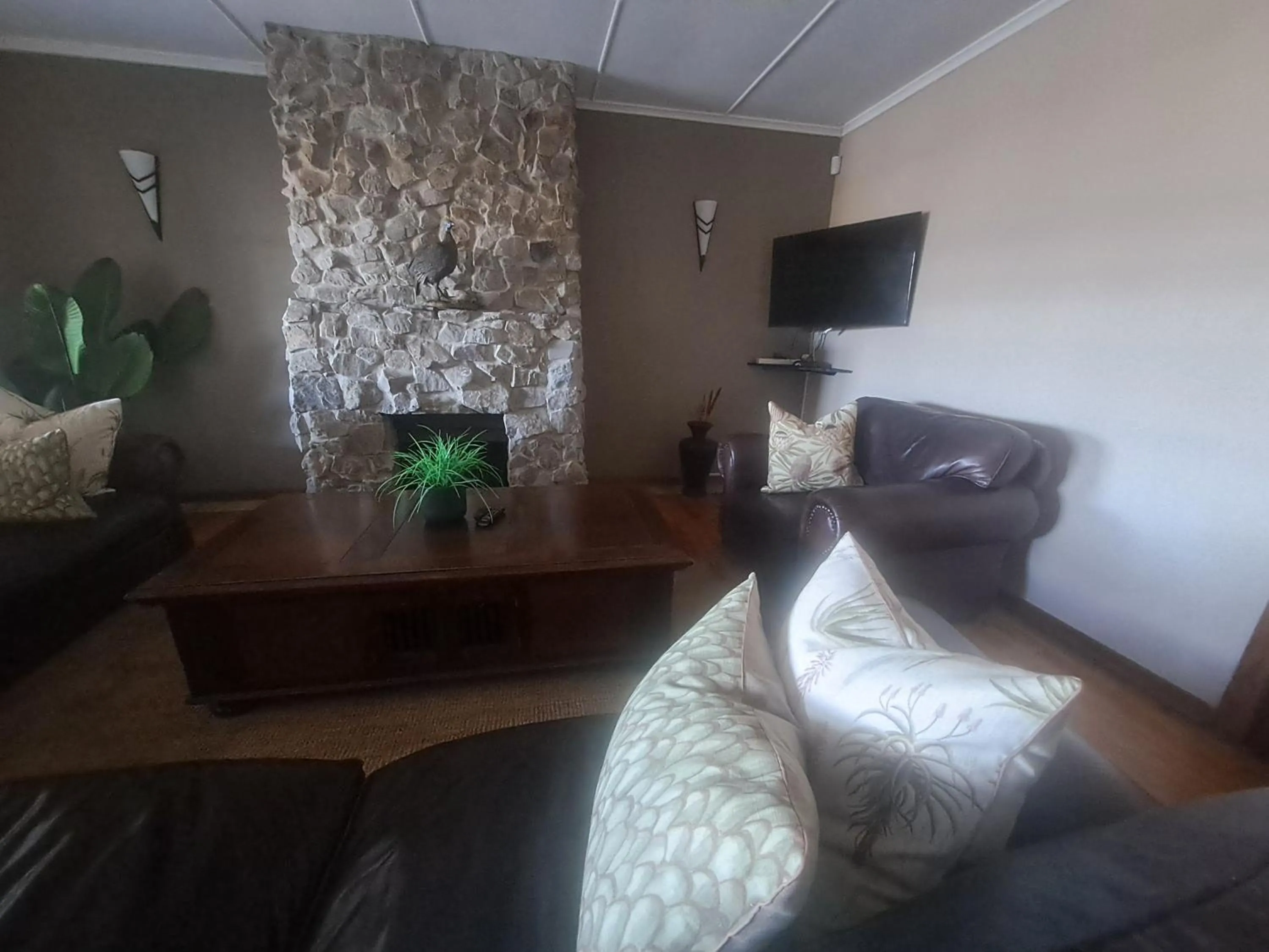 Lounge or bar in The Ranch House at African Safari Lodge