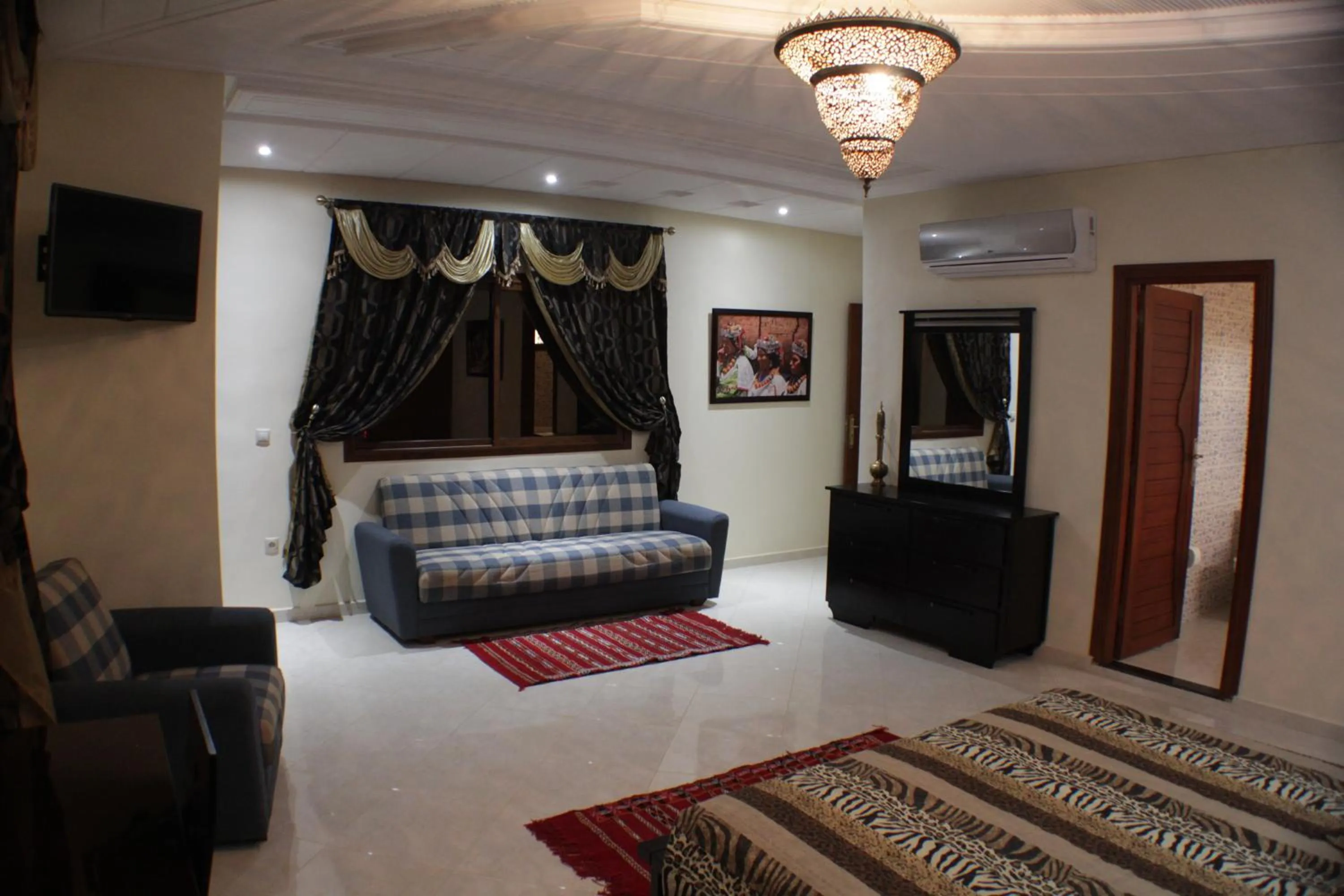 Living room, Bed in Riad Mimosa