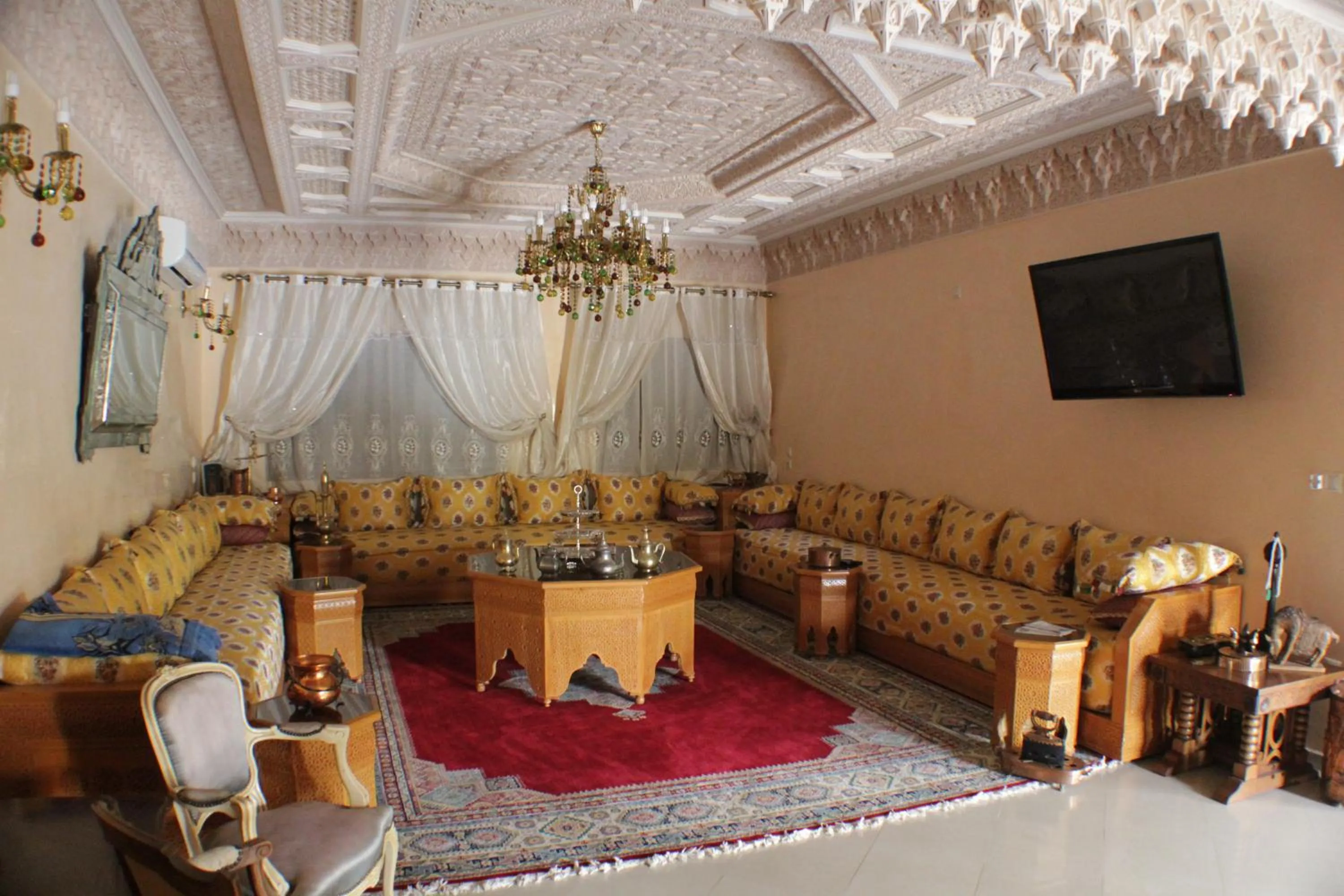 Communal lounge/ TV room in Riad Mimosa
