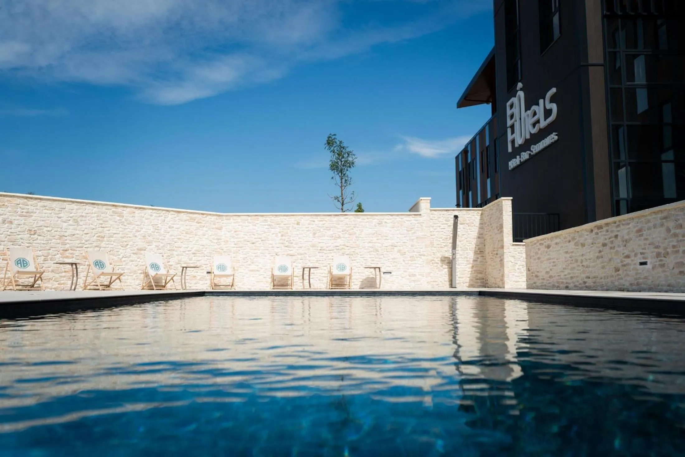 Swimming pool in Bô Hôtels Ambronay
